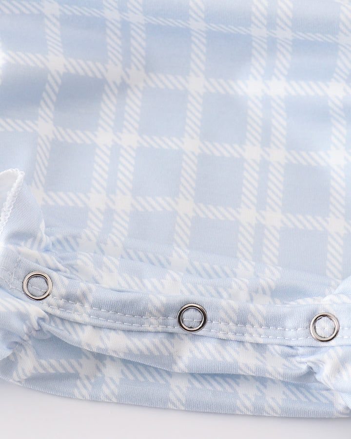 Light blue plaid girl bubble romper with snap buttons at front waist