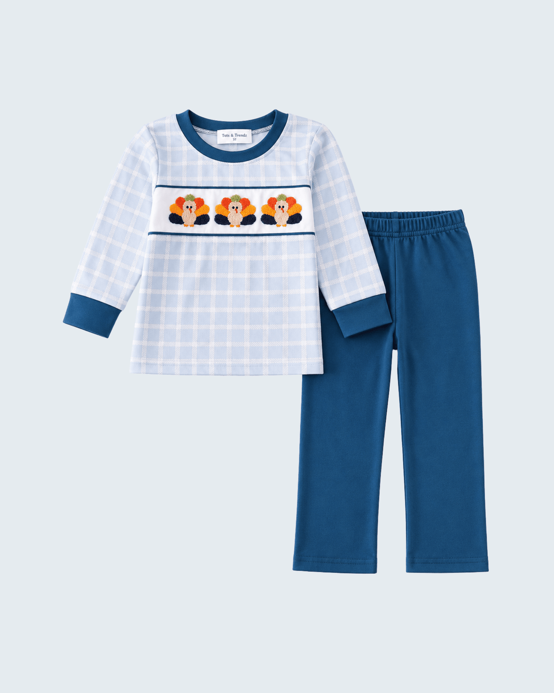 Kids plaid long-sleeve shirt and teal pants set, turkey chest graphic, dark cuffs.