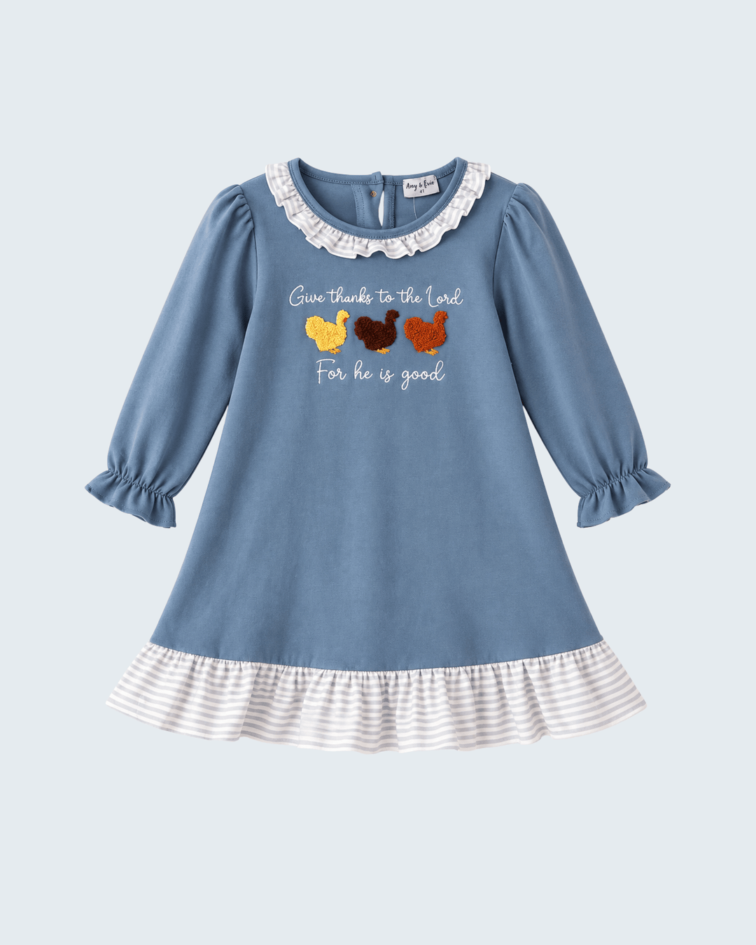 A light blue long-sleeve baby dress with a white ruffled collar, ruffled hem, and a graphic print of three chickens with the text 'Give thanks to the Lord For he is good'.