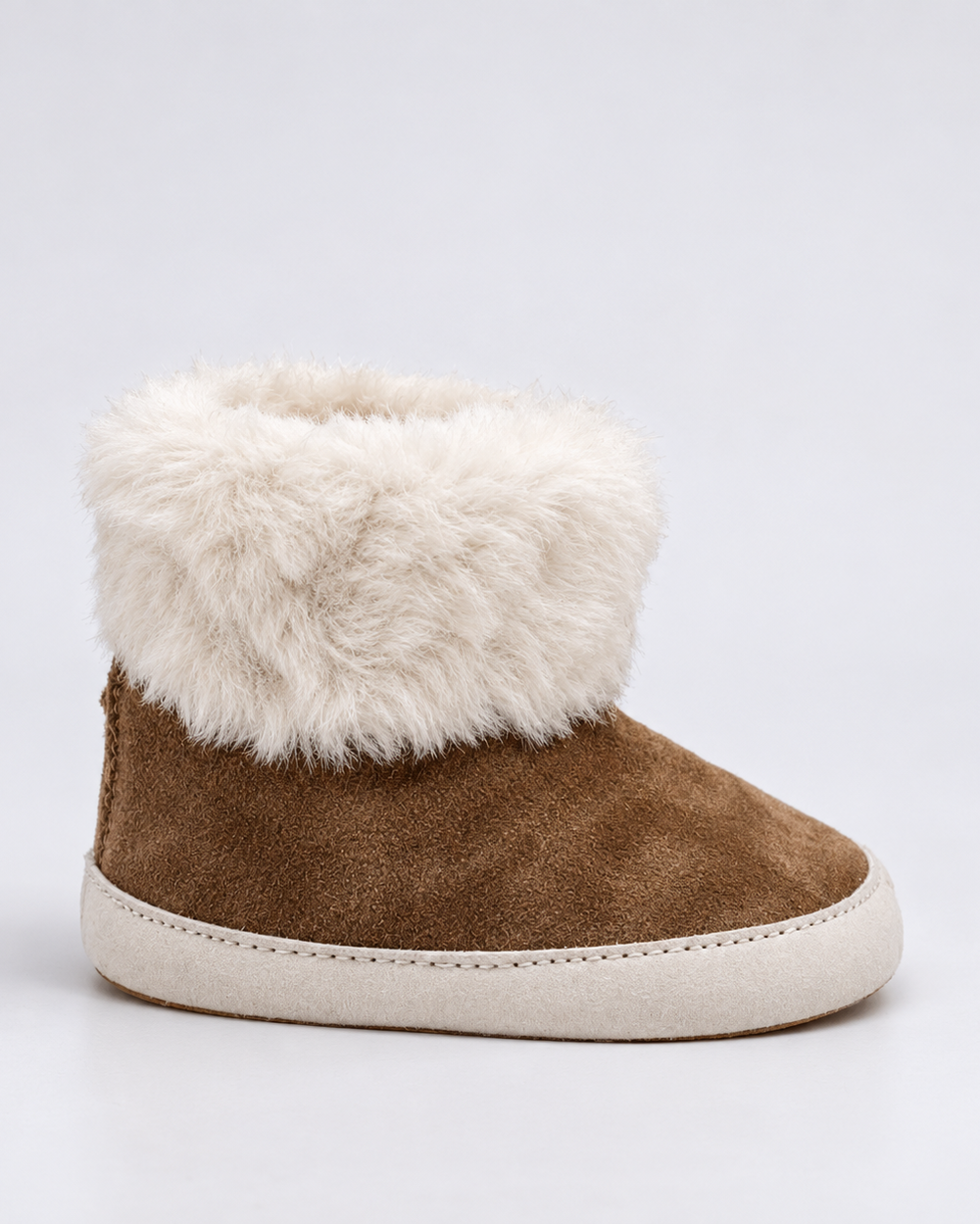 Brown suede ankle boot with thick white faux-fur cuff and cream outsole