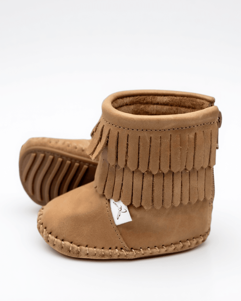 Tan suede kids boot with fringe ankle cuff and stitched side seams