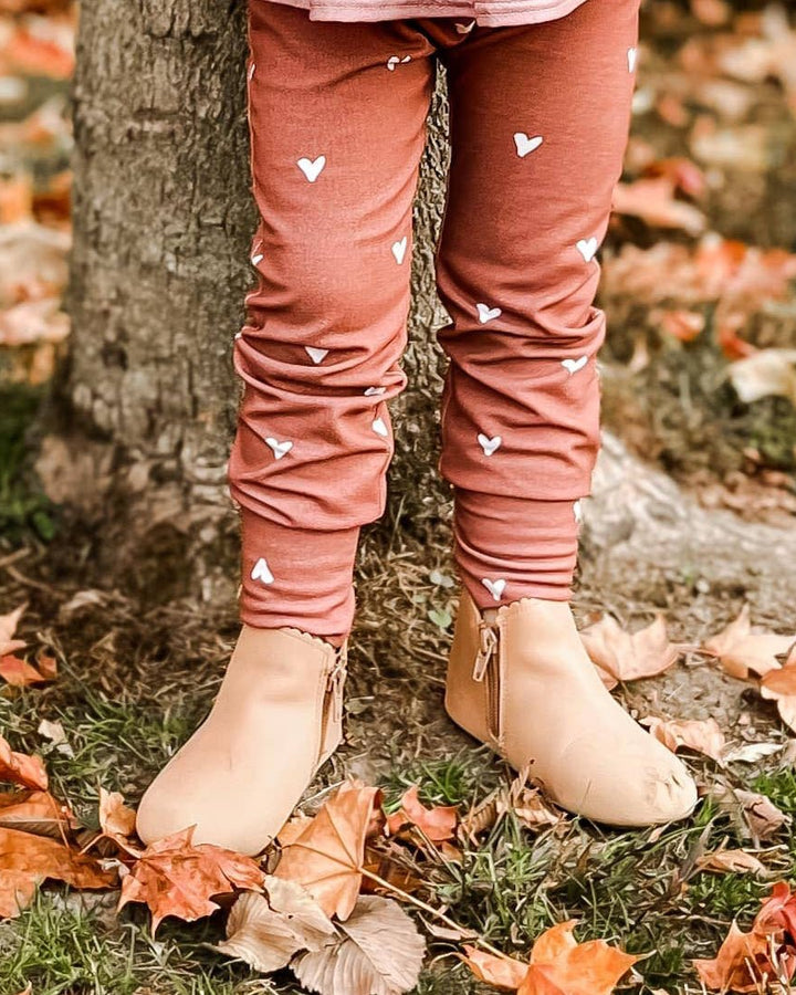 Tan suede baby boots with elastic sides and stitched toe detail