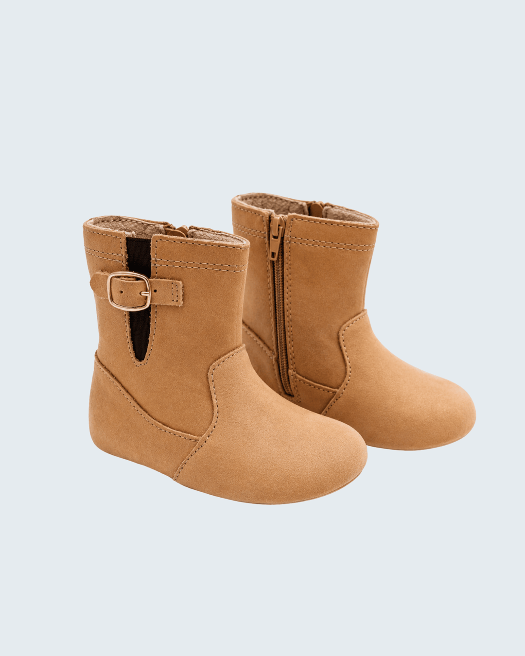 Tan suede ankle riding boots with buckle strap and side zipper