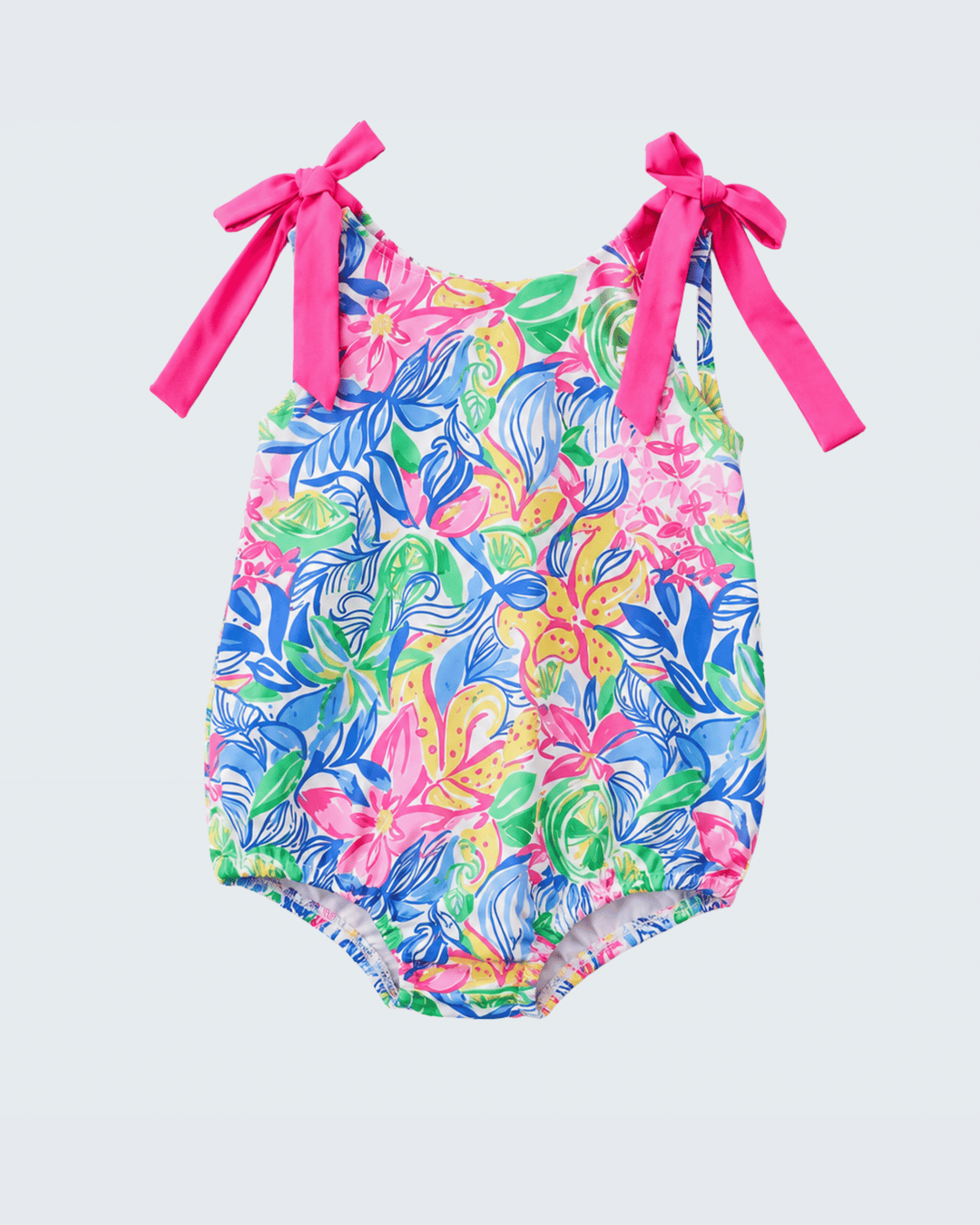 Colorful floral swimsuit with pink straps on a light gray background