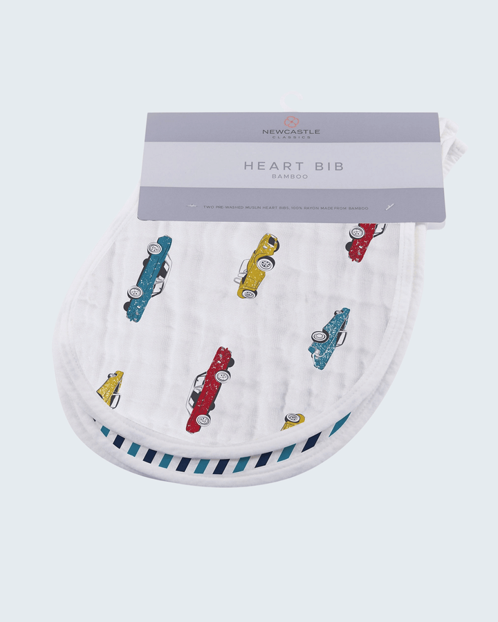 Heart-shaped bib with colorful car patterns on a white background, featuring Newcastle Baby &amp; Kids branding.