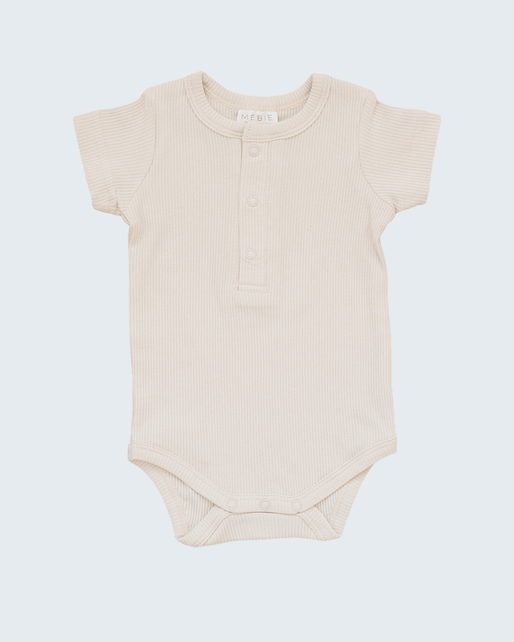 Vanilla Organic Cotton Ribbed Snap Bodysuit on light grey background