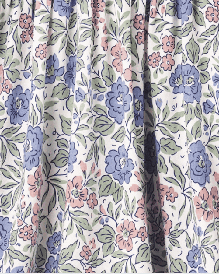 Pastel floral fabric with blue, pink, and green flowers and leafy details