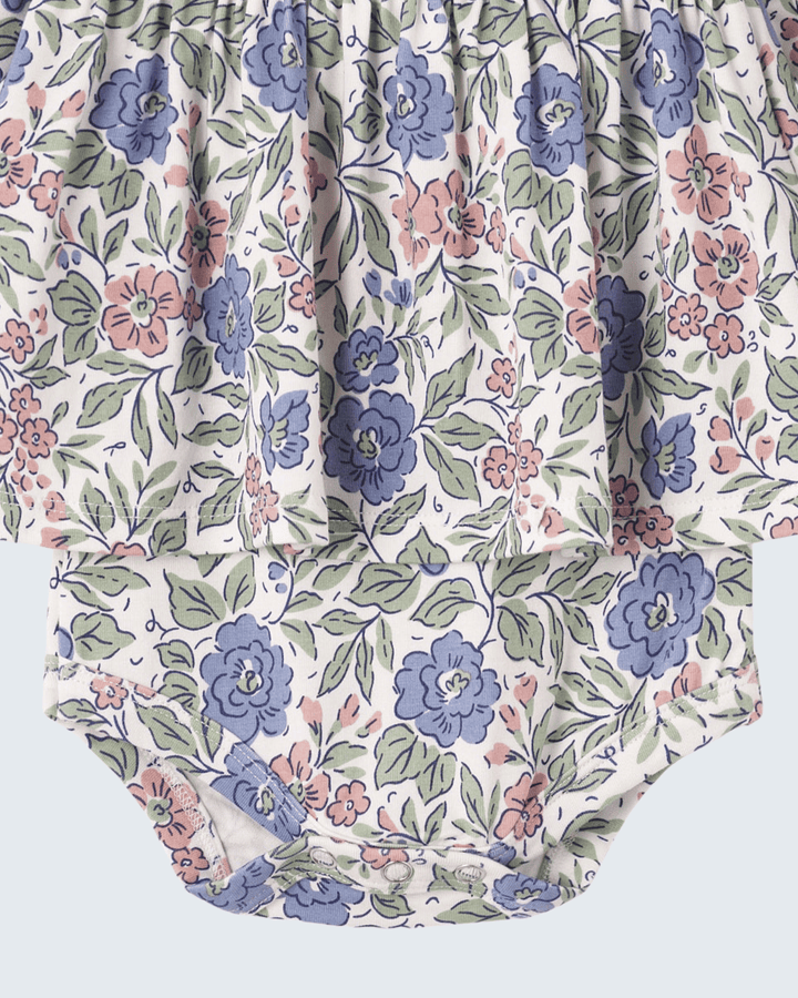 Floral skirted baby bodysuit with ruched hem and full-length sleeves