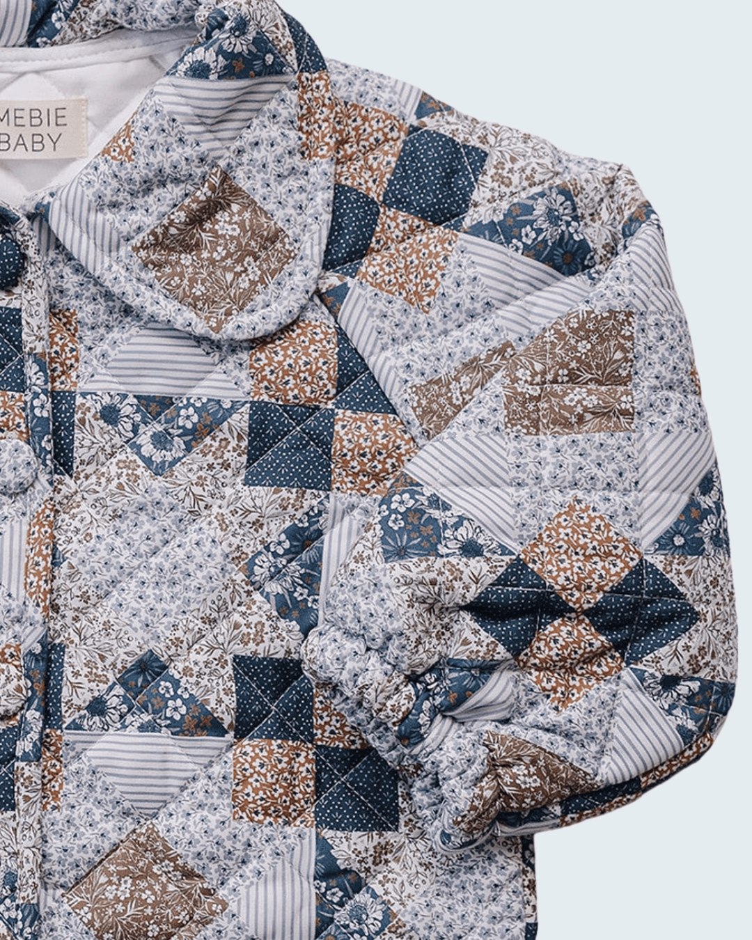 A close-up of a quilted girl&