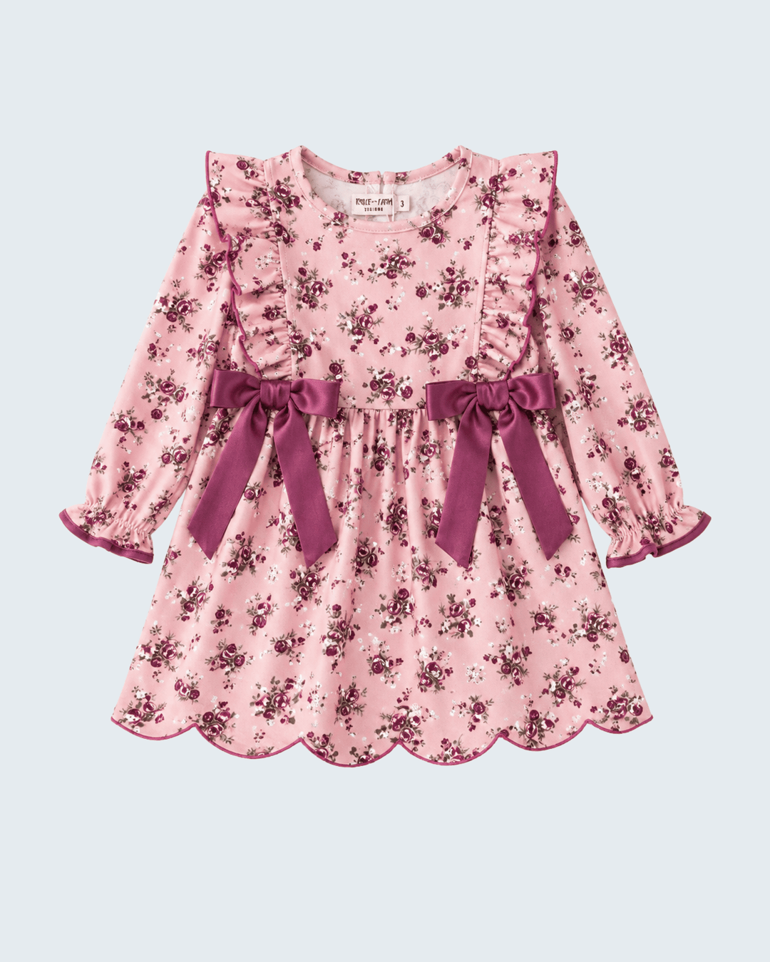 Girls' pink floral ruffle dress with bow ties at the waist and long puff sleeves