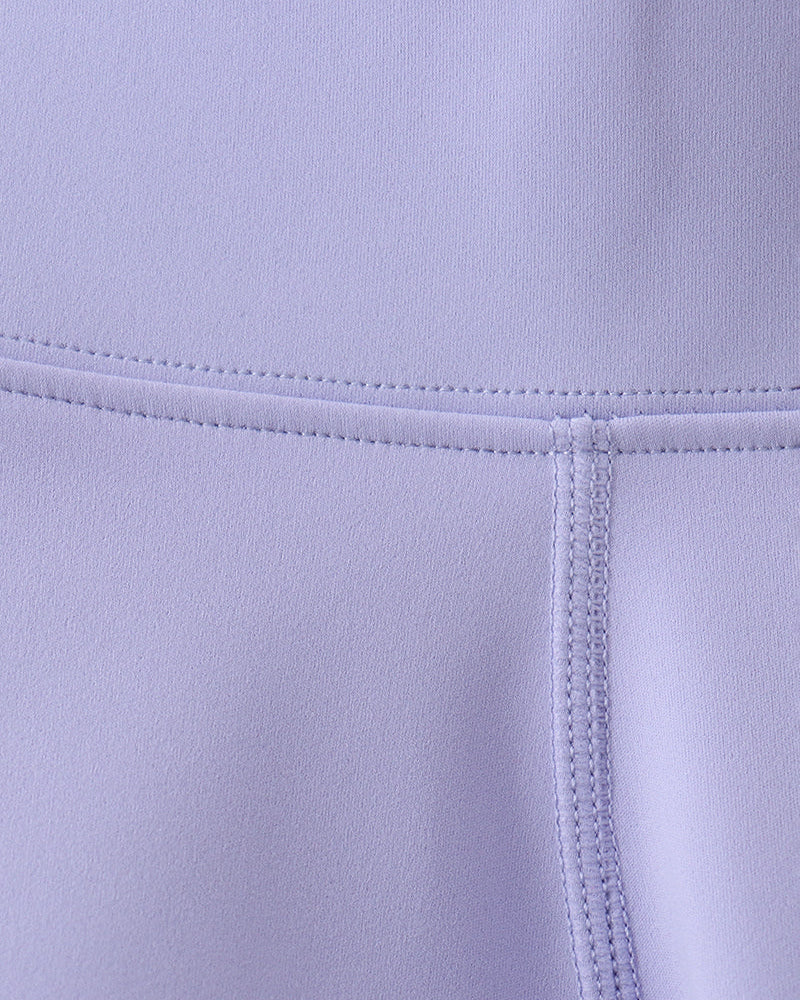 Close-up of a light purple fabric with stitching detail