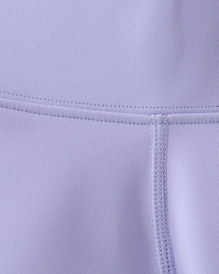 Close-up of a light purple fabric with stitching detail