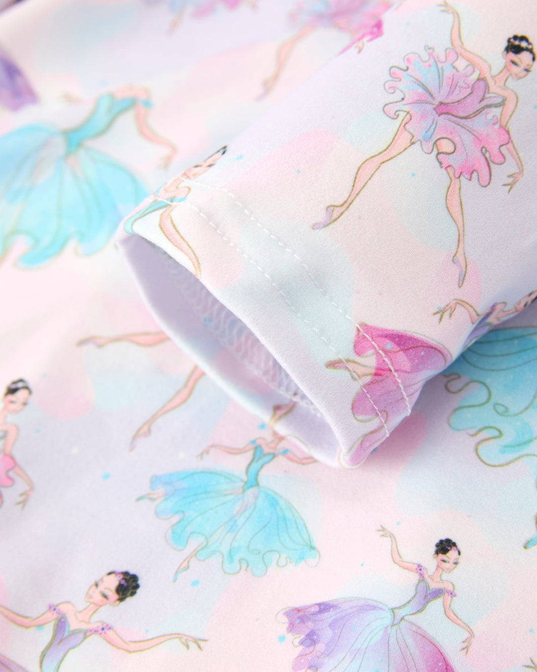 Fabric with ballerina designs on a pastel background