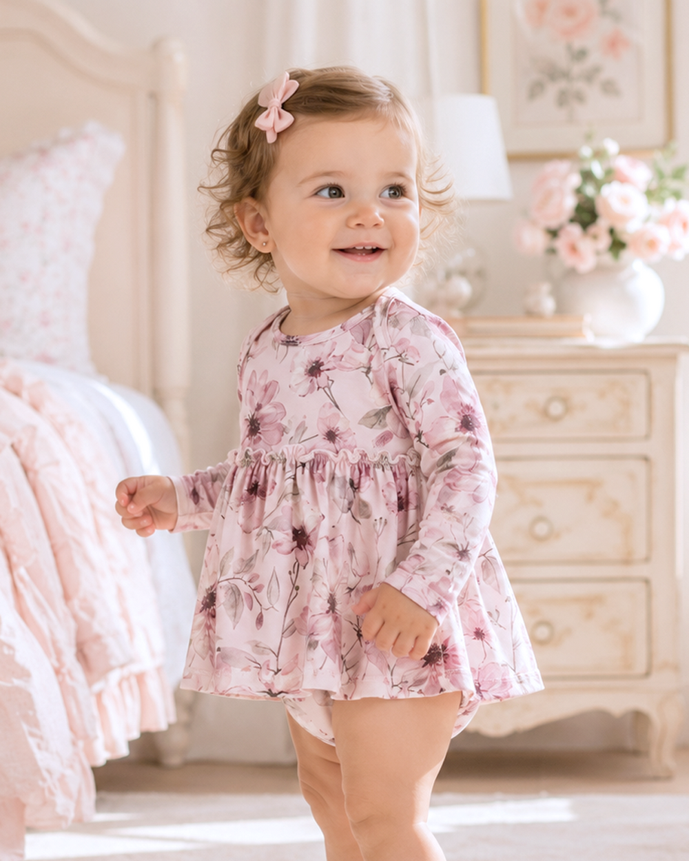 Pink watercolor floral long-sleeve bodysuit with ruffled skirt overlay