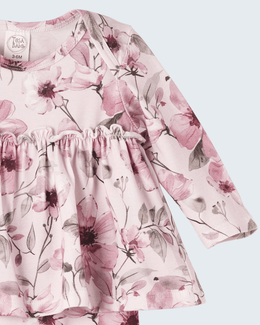 Pink watercolor floral long-sleeve bodysuit with ruched yoke and skirted ruffle