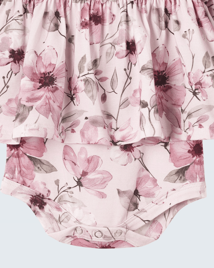 Pink watercolor floral bodysuit with gathered skirt hem