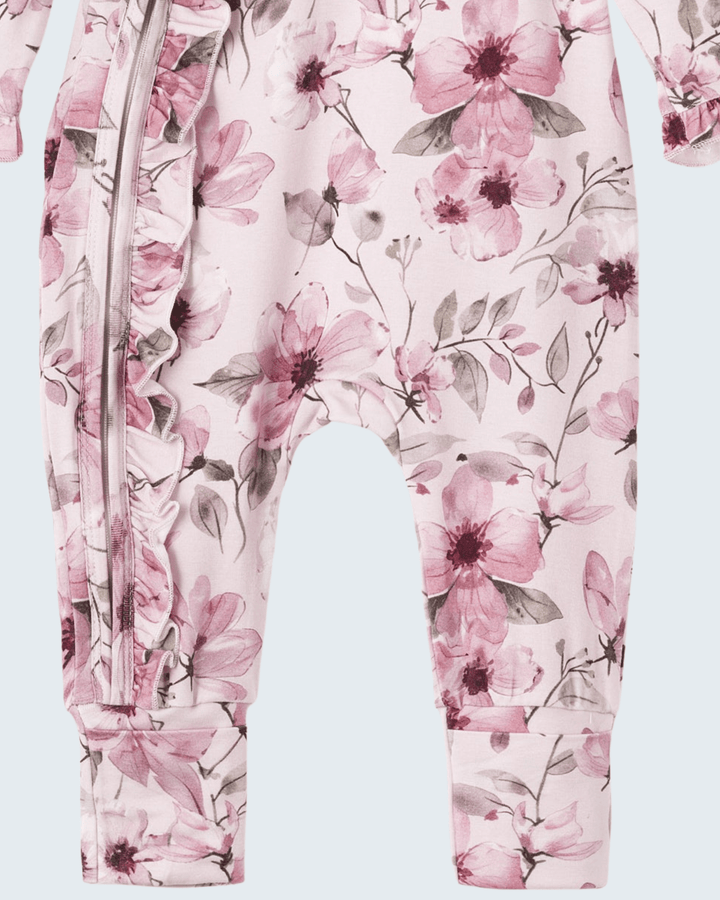 Pink floral bamboo zipper romper, close-up of front zipper and leg cuffs