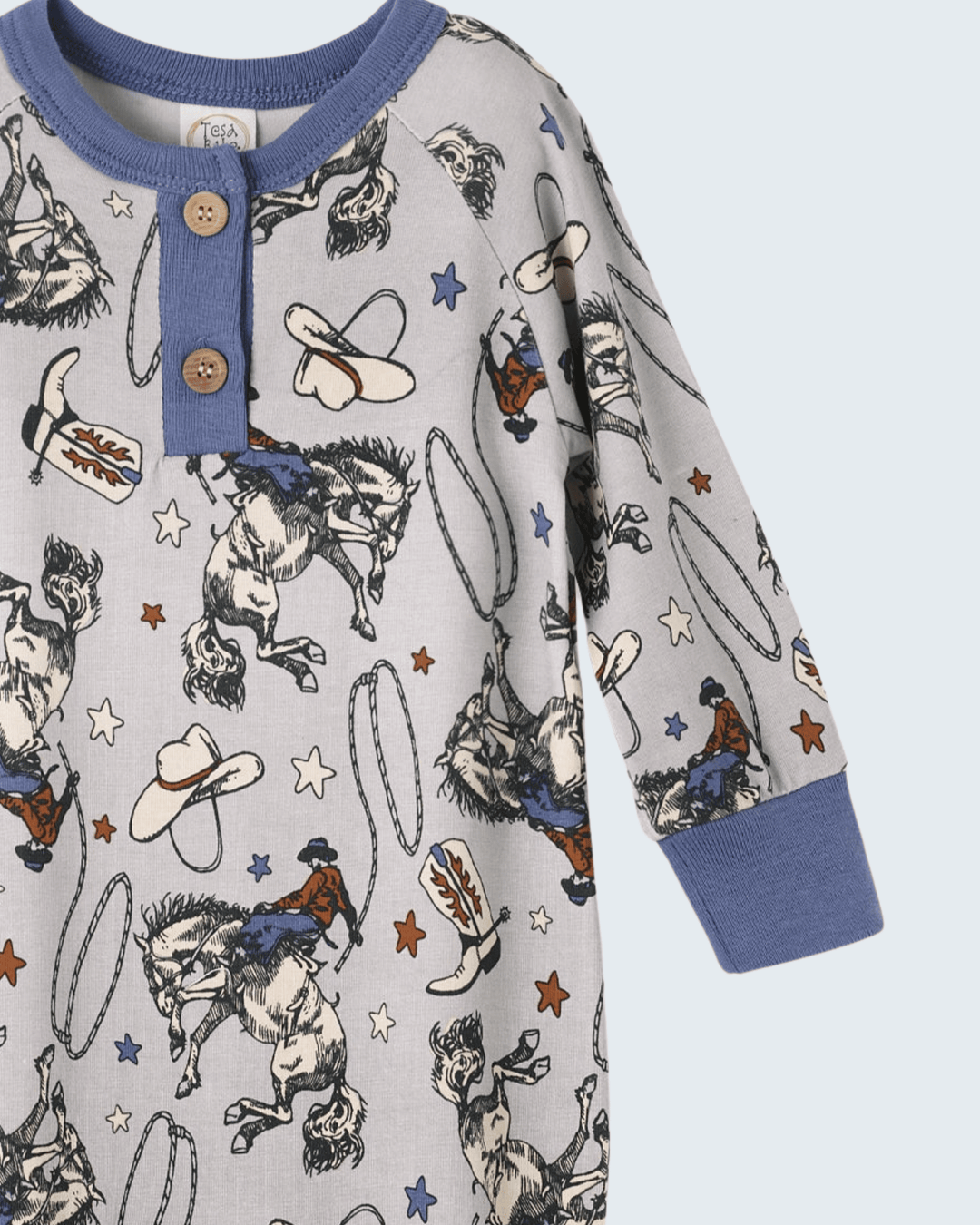 Cowboy print henley bamboo romper with two-button placket and navy long-sleeve cuffs