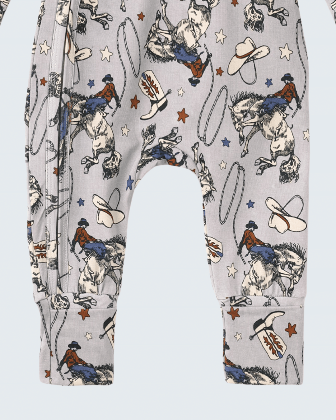 Light gray western romper legs with rodeo horses, cowboys, cowboy boots and star print