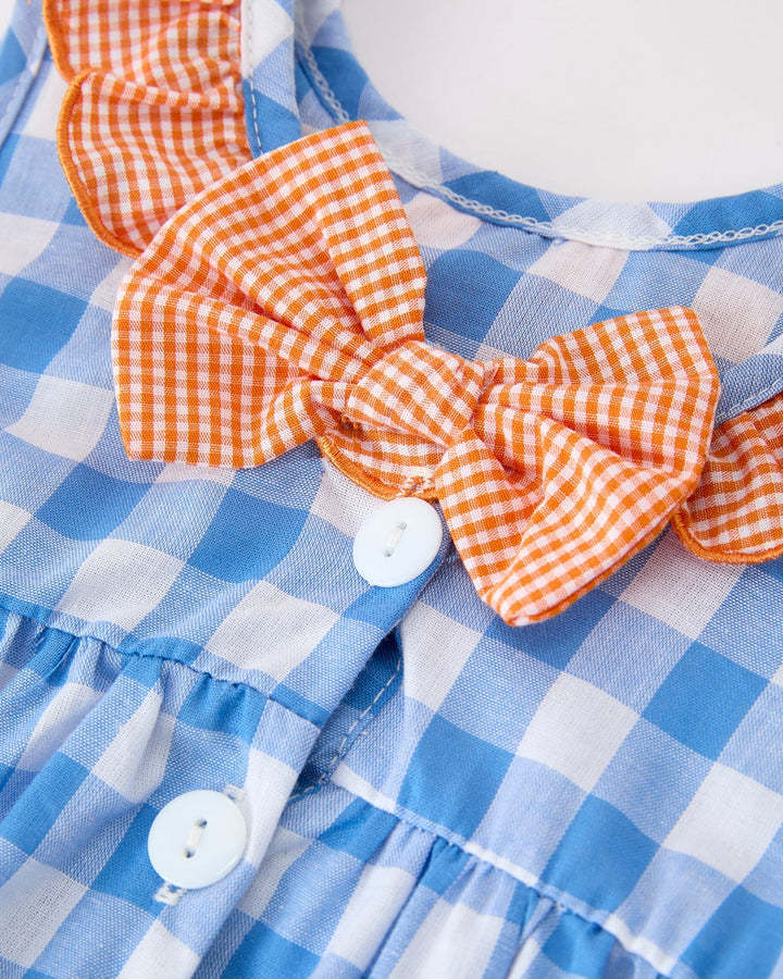 Blue checkered girls dress with orange bow
