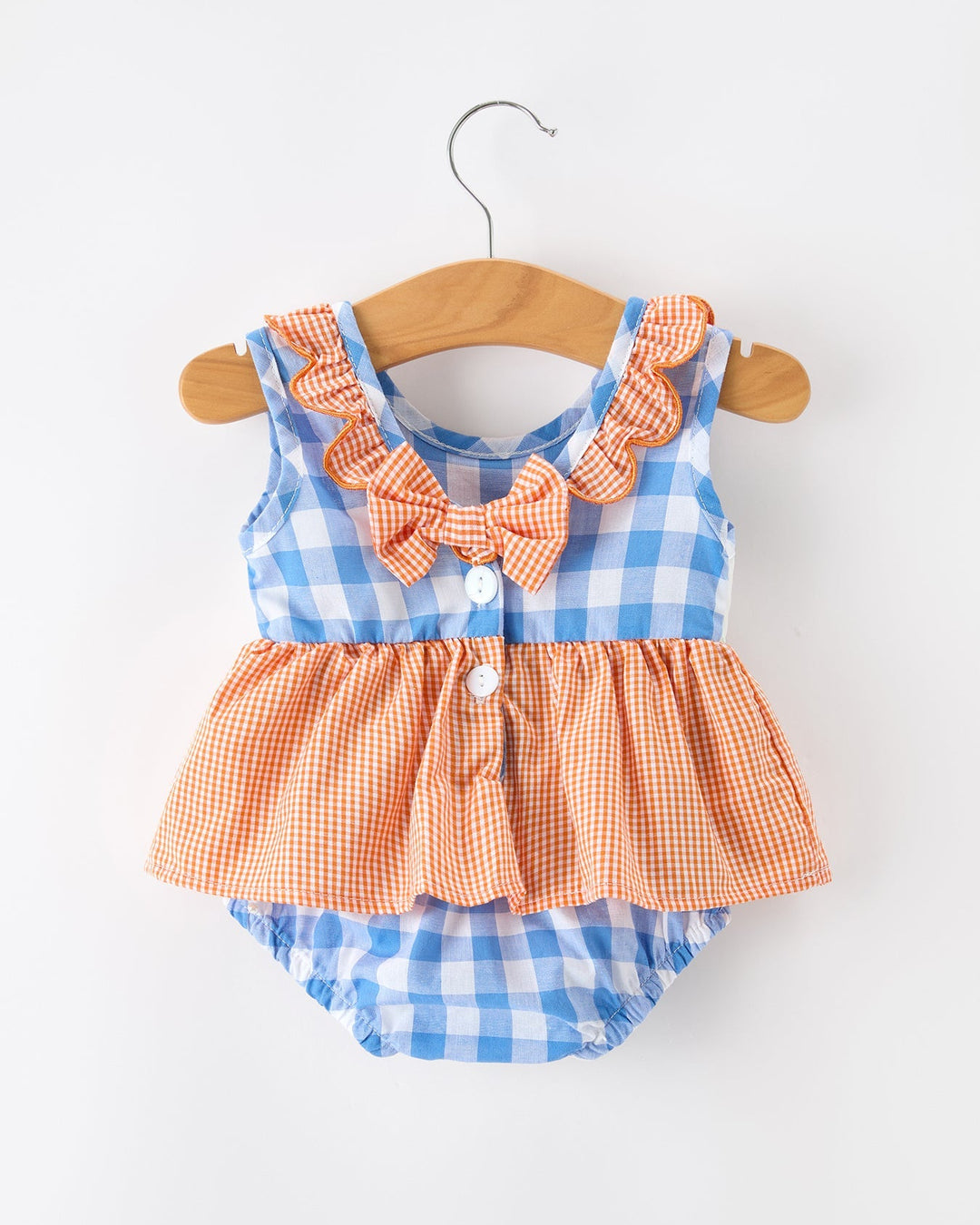 Baby romper with blue and orange checkered pattern on a white background