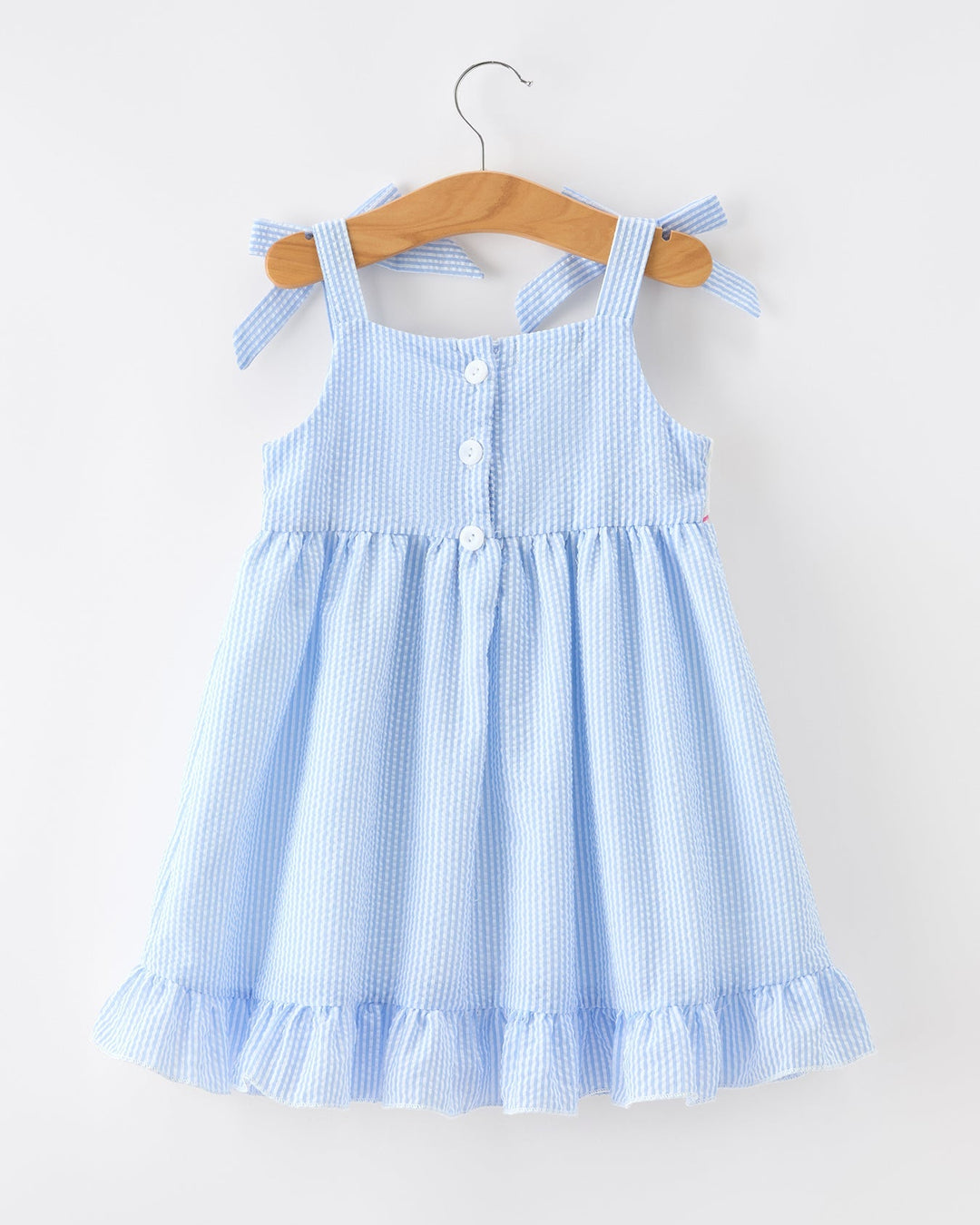 Girls blue seersucker dress on hanger