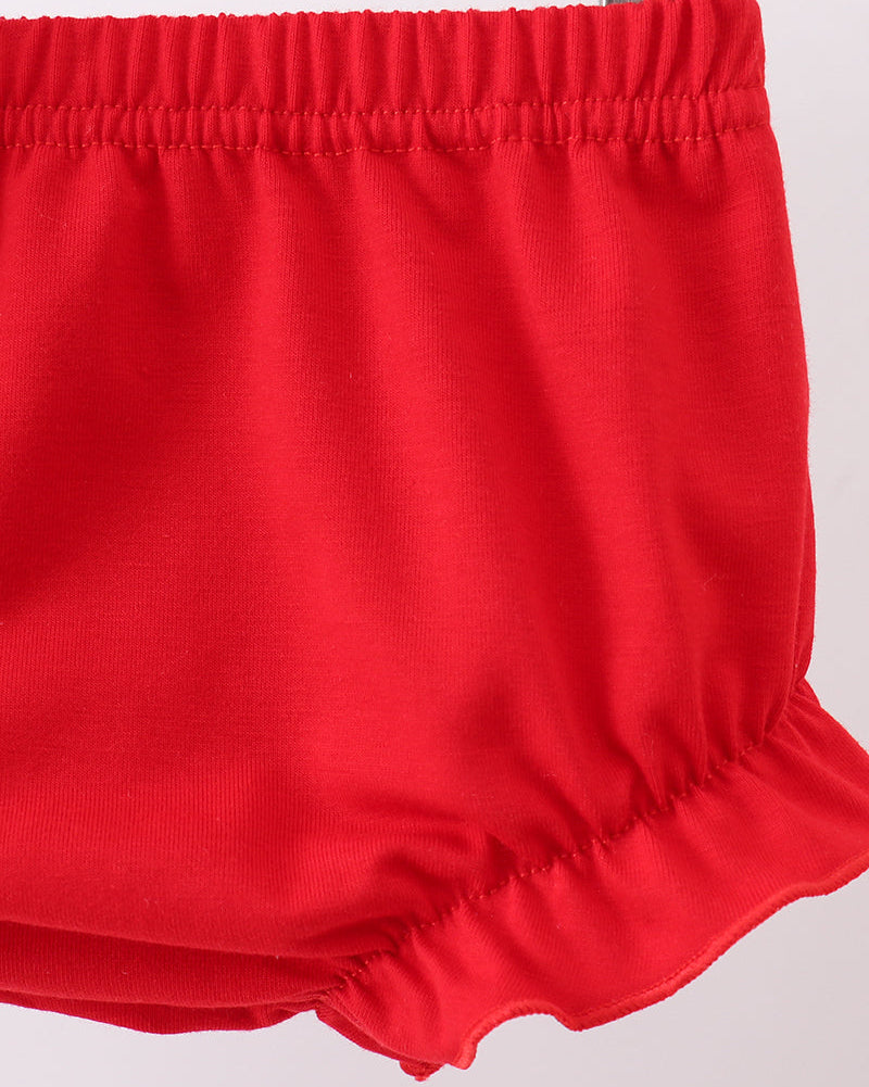 Red shorts on a light gray background