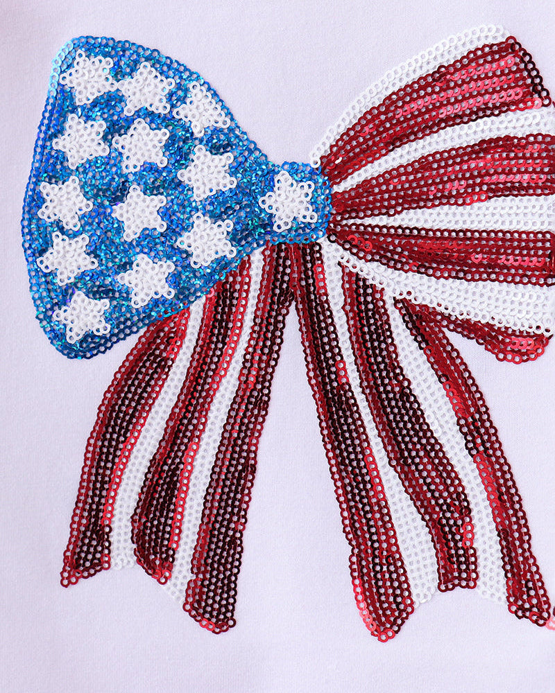 Bow with American flag design made of beads on a white background