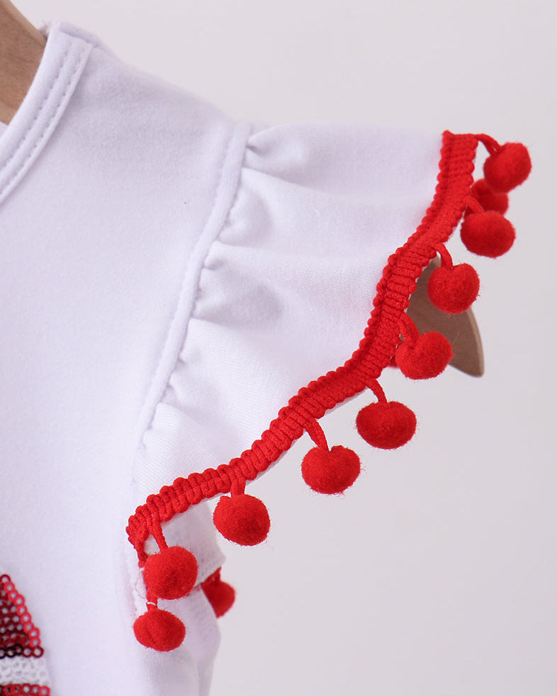 White garment with red pom-pom trim on a white background
