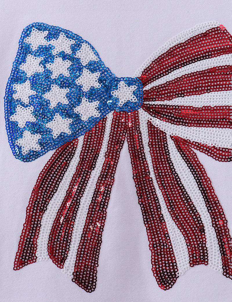 Beaded bow with American flag design on a white background