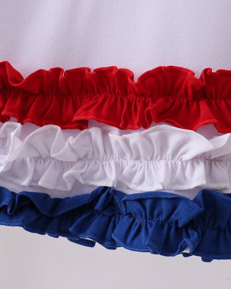 Close-up of a ruffled trim in red, white, and blue on a white background