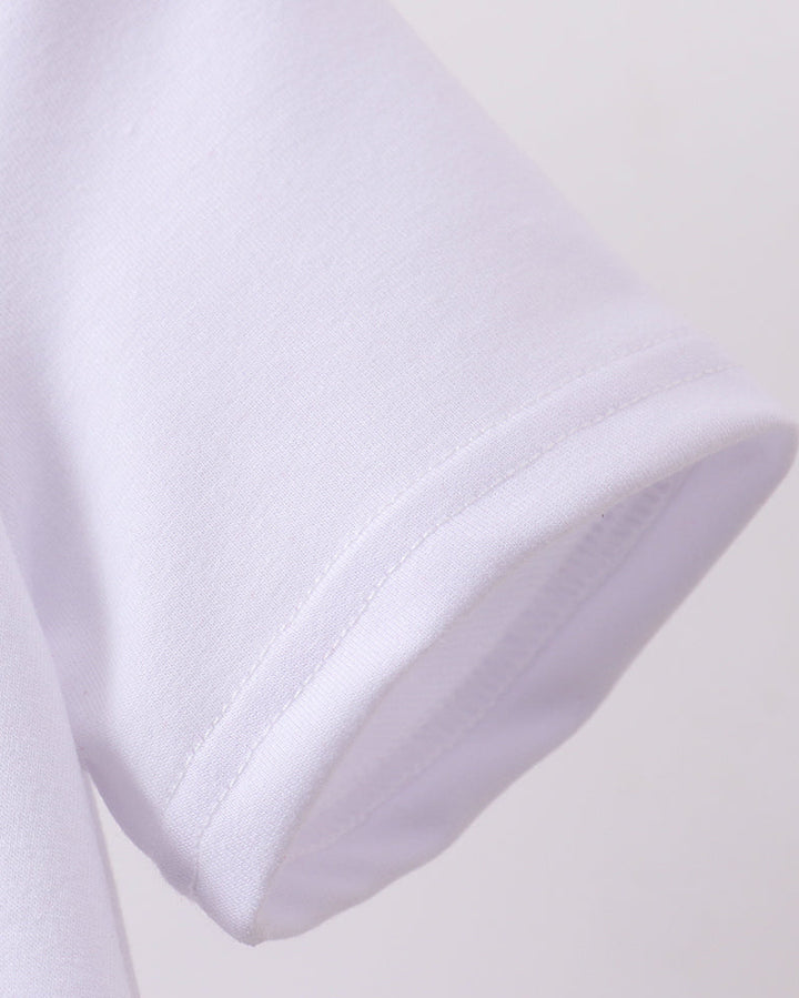 Close-up of a white shirt collar on a light gray background