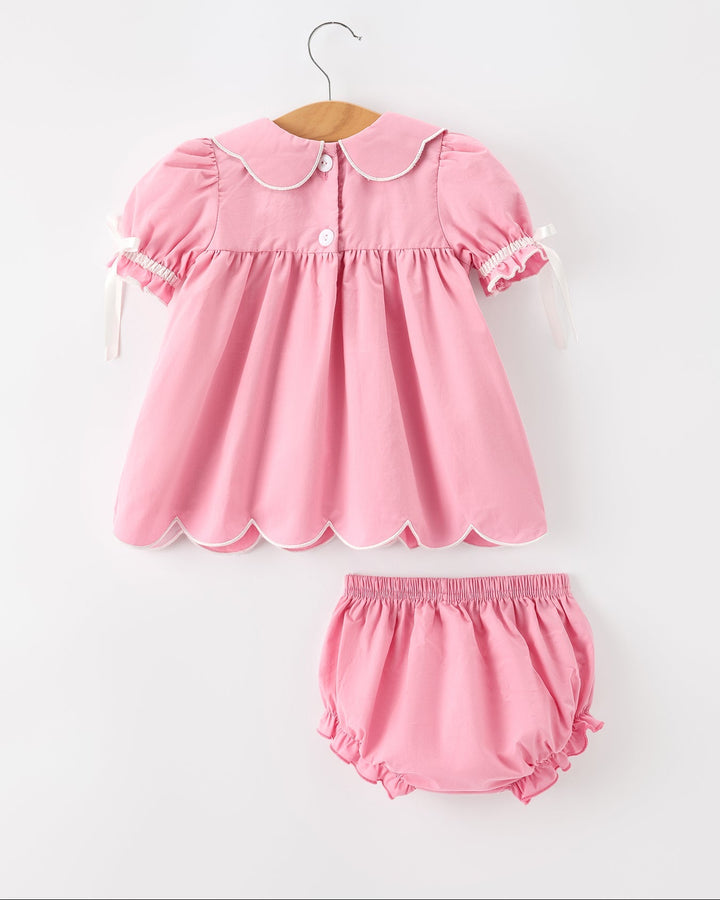 Girls pink christening dress and bloomers set with buttoned collar and cross detailing