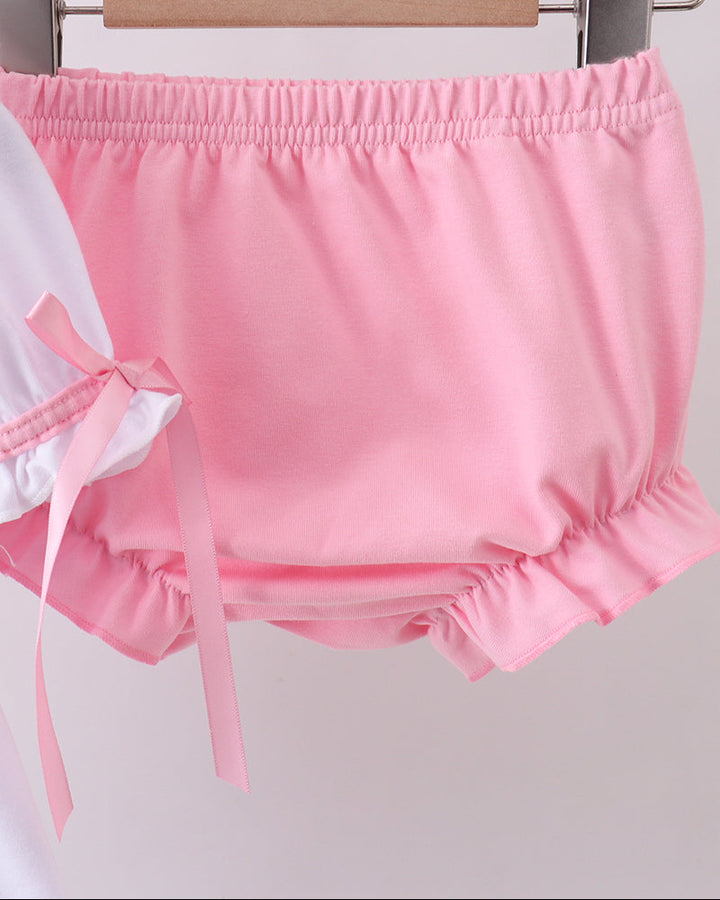 Pink bloomer shorts with bow details and gathered elastic waistband
