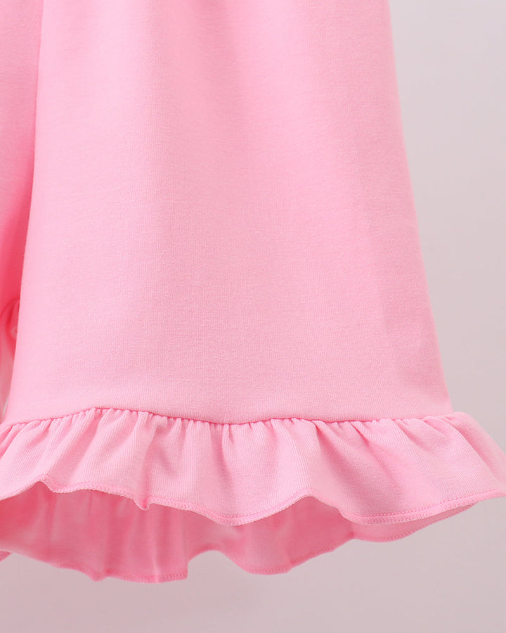 Pink ruffle hem top with gathered finish