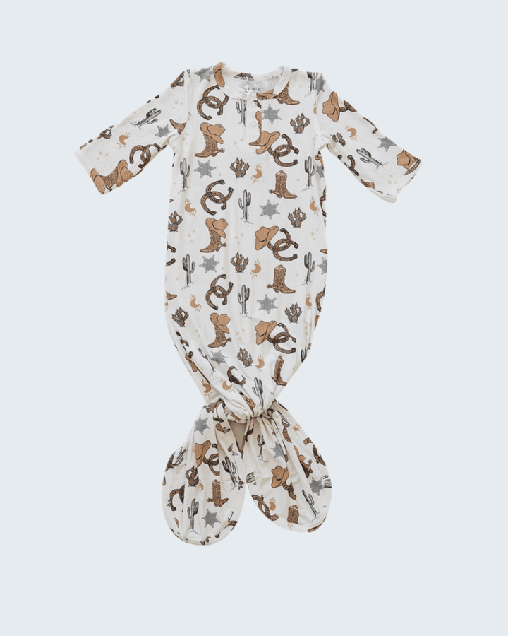 Baby onesie with cowboy pattern on a white background