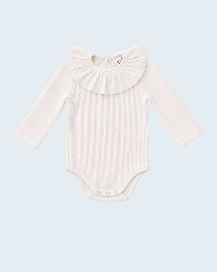 An off-white ribbed long-sleeve baby bodysuit with a large ruffled collar, displayed flat against a light blue-gray background.