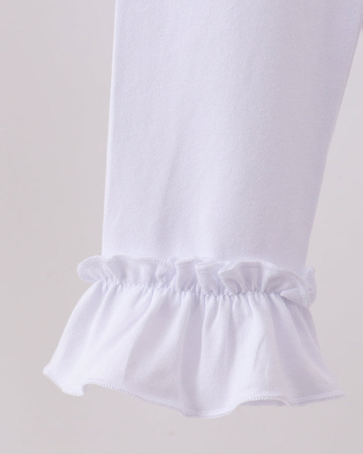 White ruffle hem leggings with elastic waist and layered flounce cuff