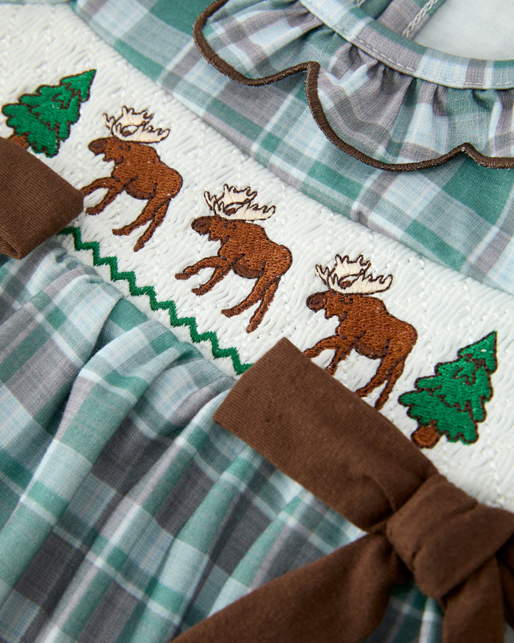 Green-and-white plaid bubble romper with moose applique, green tree details and brown sash
