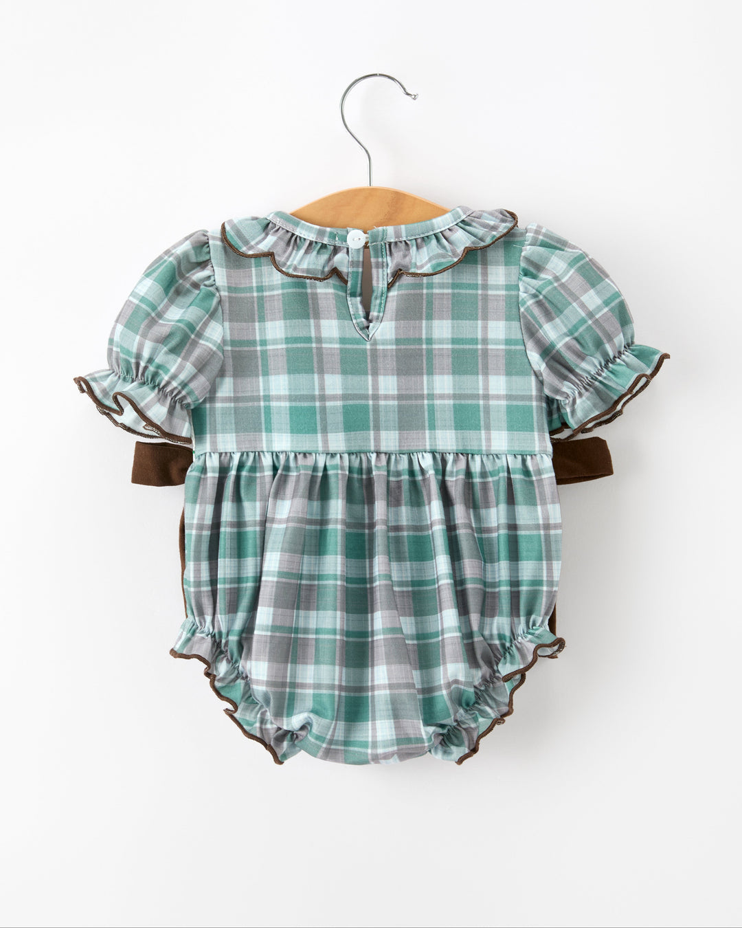 Green plaid baby girl bubble romper with ruffled sleeves, buttoned bodice and brown tie