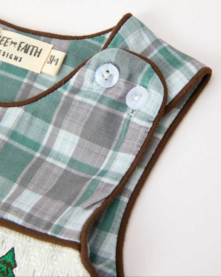 Green plaid JonJon with brown trim and two front buttons on the sleeveless bib