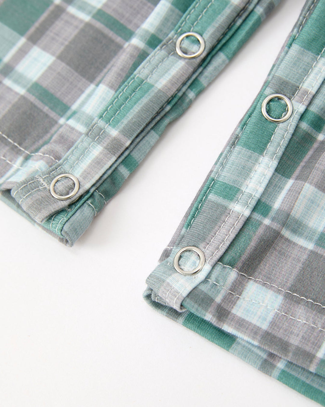 Green-gray plaid JonJon with metal eyelets on leg openings and brown-stitched trim