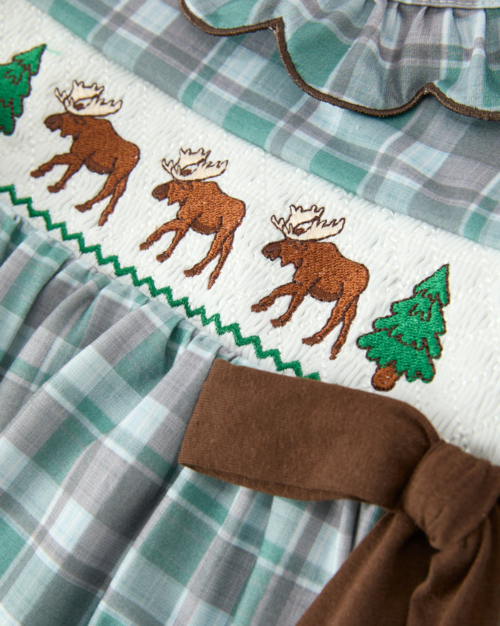 Moose and pine embroidery on girls plaid dress with brown waistband and gathered skirt