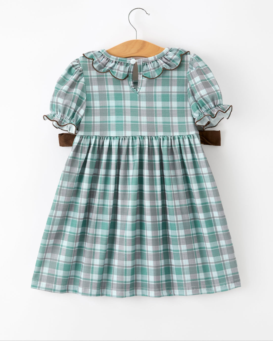 Girls teal and white plaid puff sleeve dress with gathered waist and brown bow ties