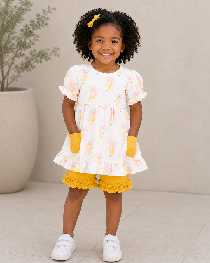 Young girl wearing Yellow Back To School Ruffle Shorts Set