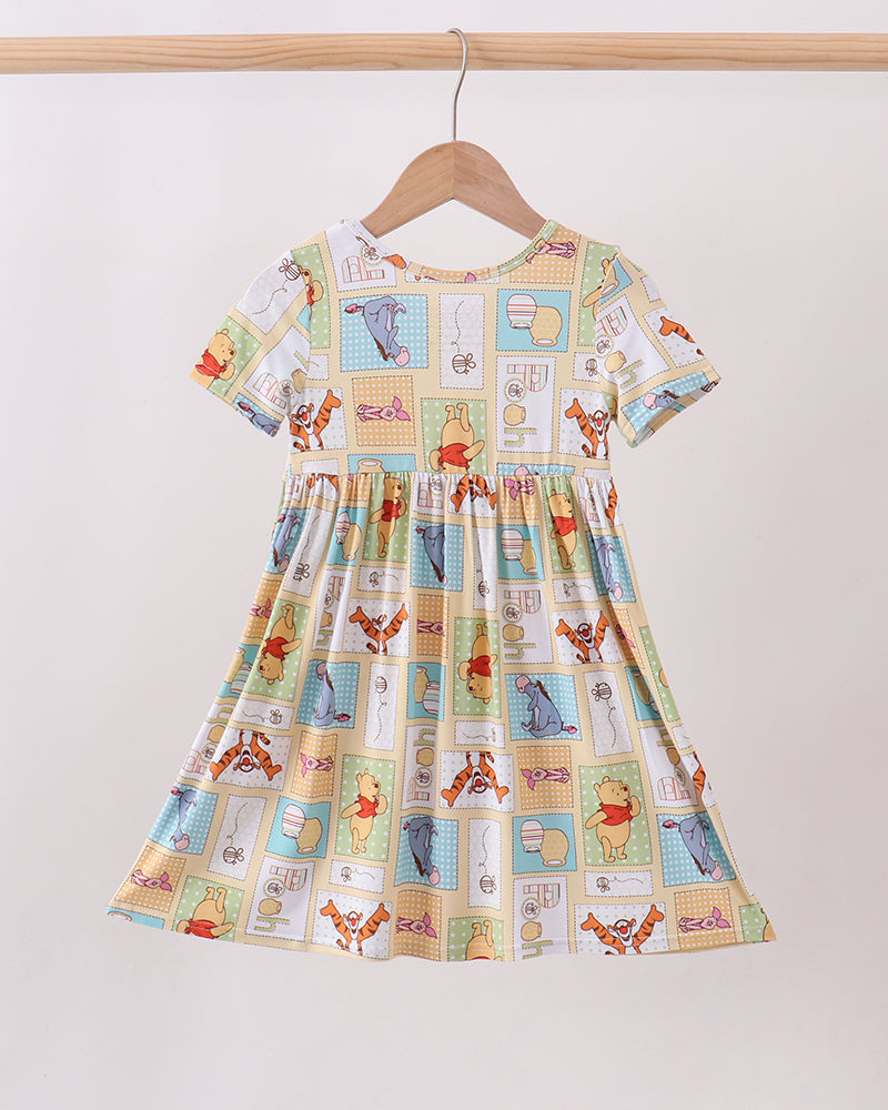 Bamboo baby dress with Winnie the Pooh patchwork animal print, short sleeves and gathered waist