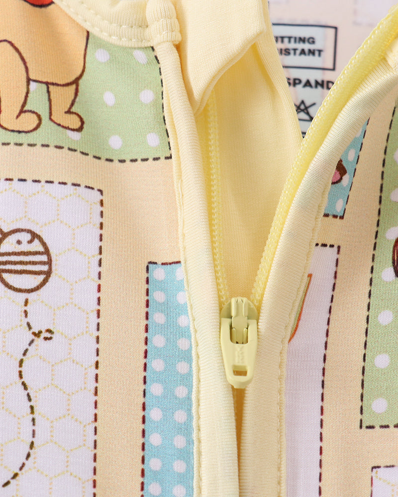 Yellow baby romper front zipper with soft ribbed collar and patchwork cartoon print