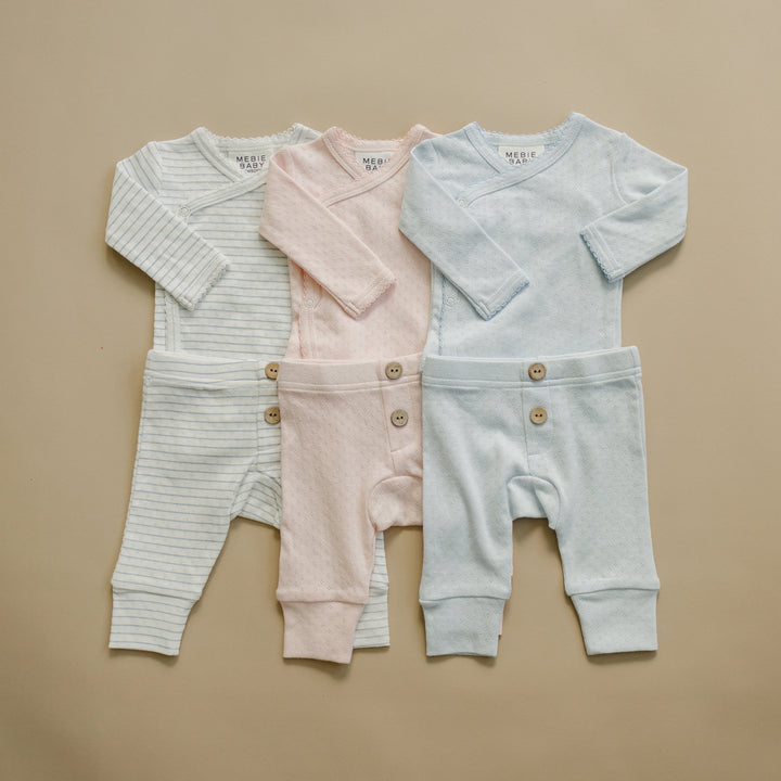 Baby layette sets in gray, pink, and light blue: long-sleeve tops with cuffed pants