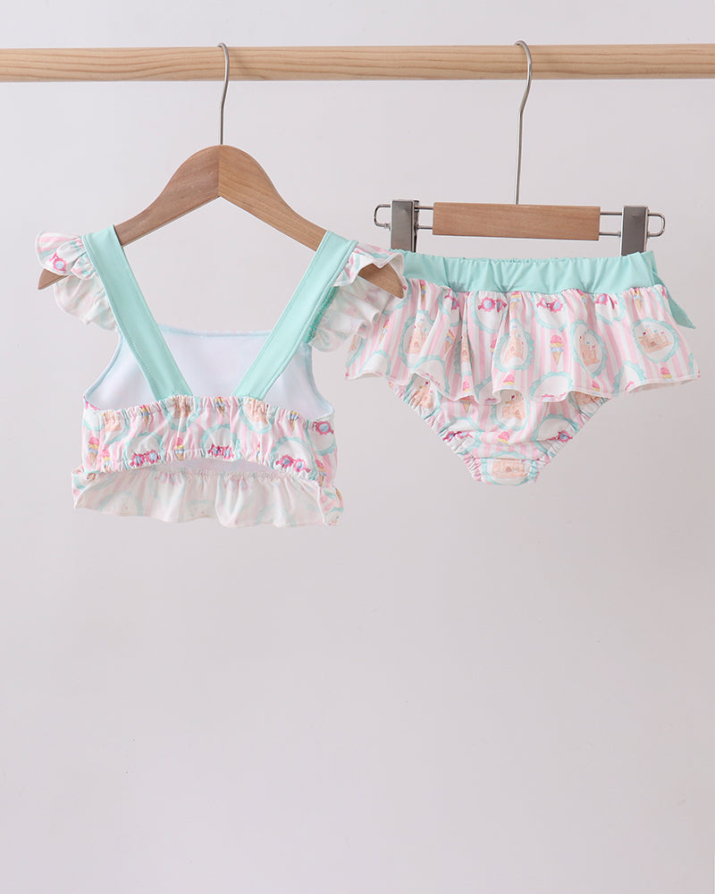 Swimsuit set on hangers against a white background